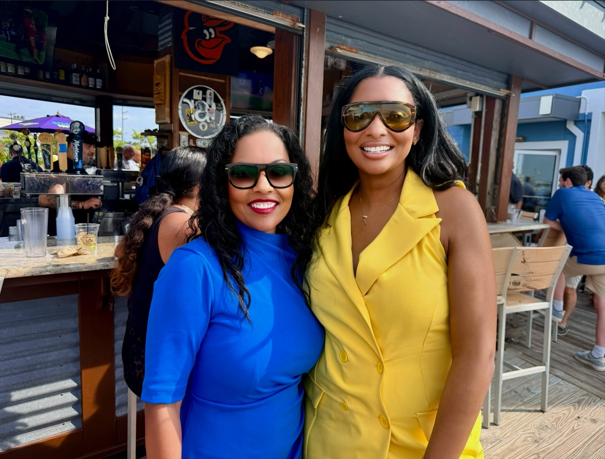 Yvonne Harper with a supporter at a Maryland waterfront community gathering