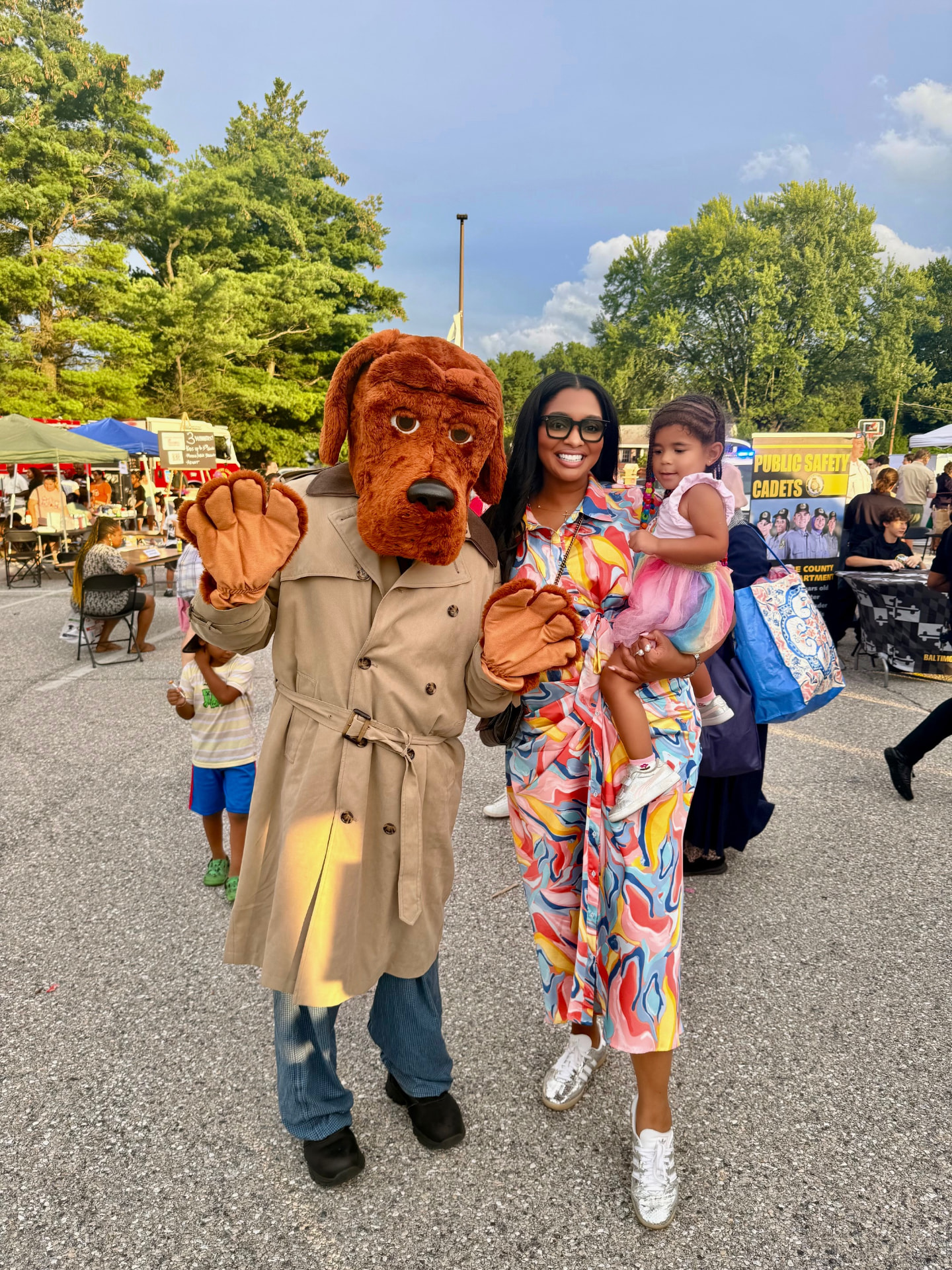 Yvonne Harper with McGruff the Crime Dog and a child at a Baltimore County public safety night