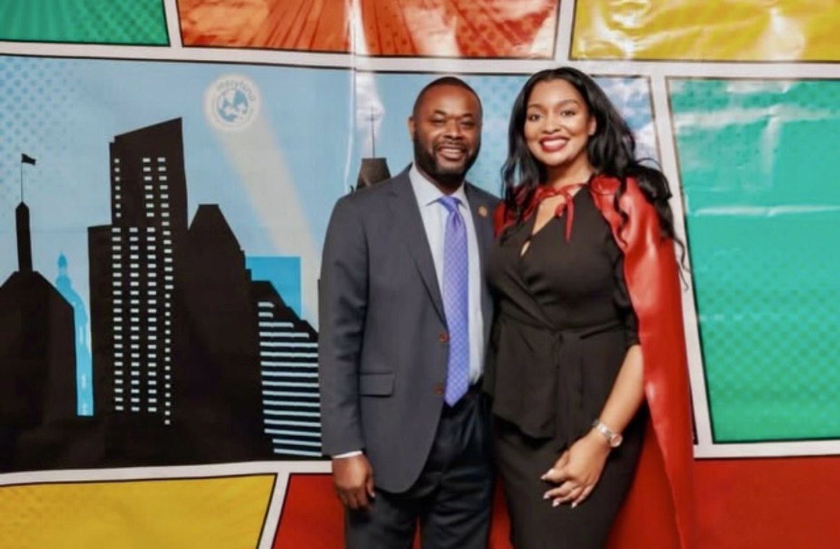 Yvonne Harper with an elected official at a Maryland community event